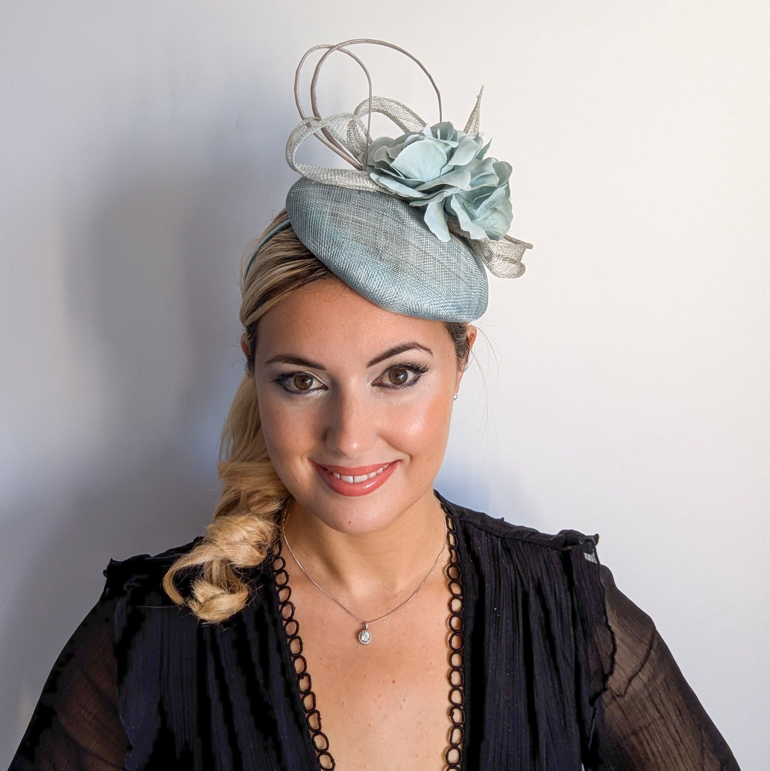 Aquamarine blue flower fascinator hat