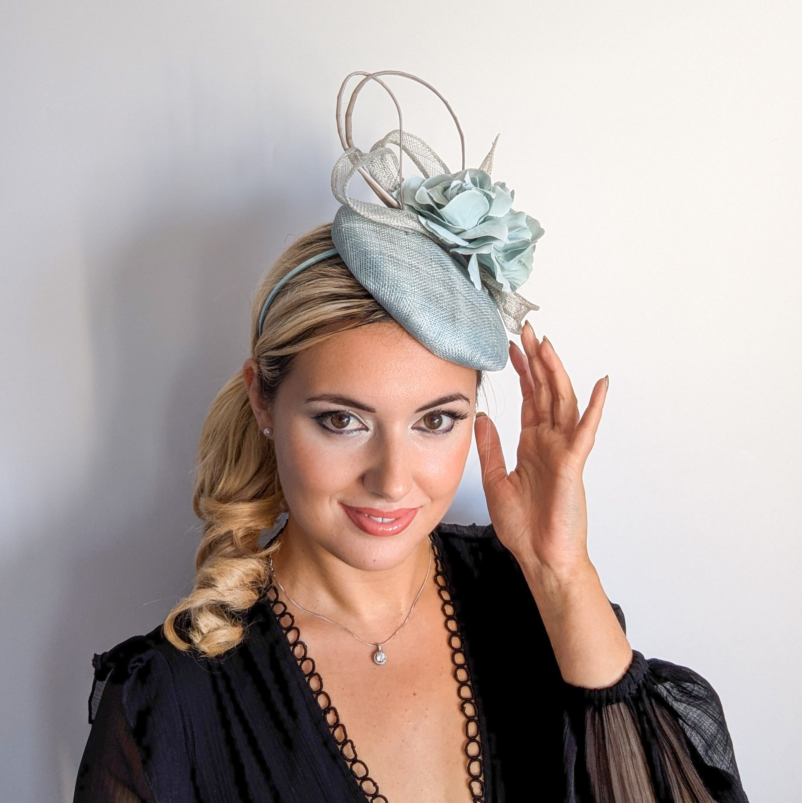 Aquamarine blue flower fascinator hat