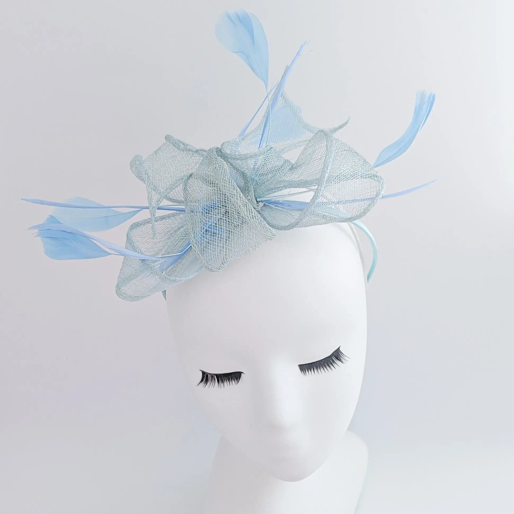 Aquamarine blue feather fascinator hat - House of Hats