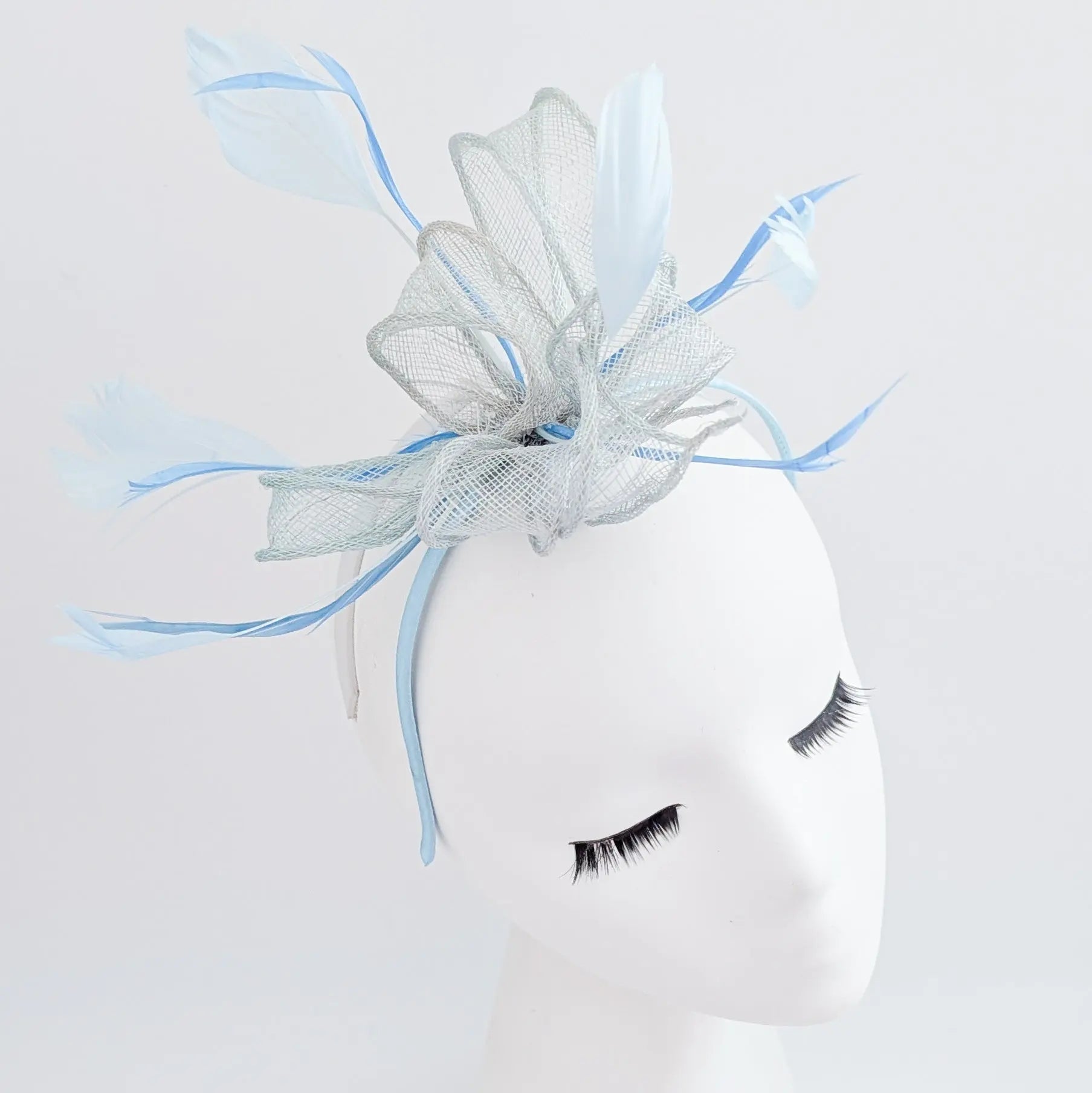 Aquamarine blue feather fascinator hat - House of Hats