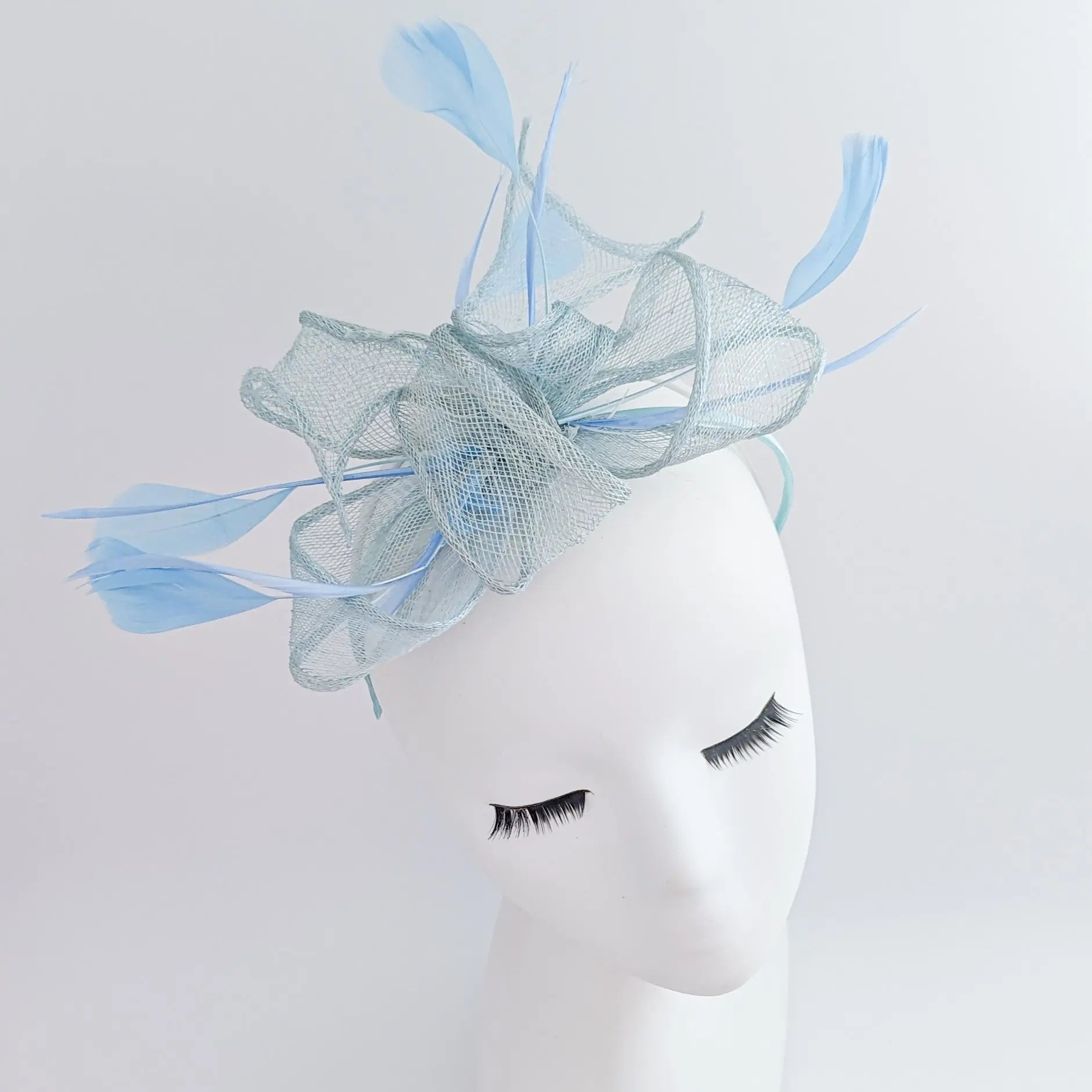 Aquamarine blue feather fascinator hat - House of Hats