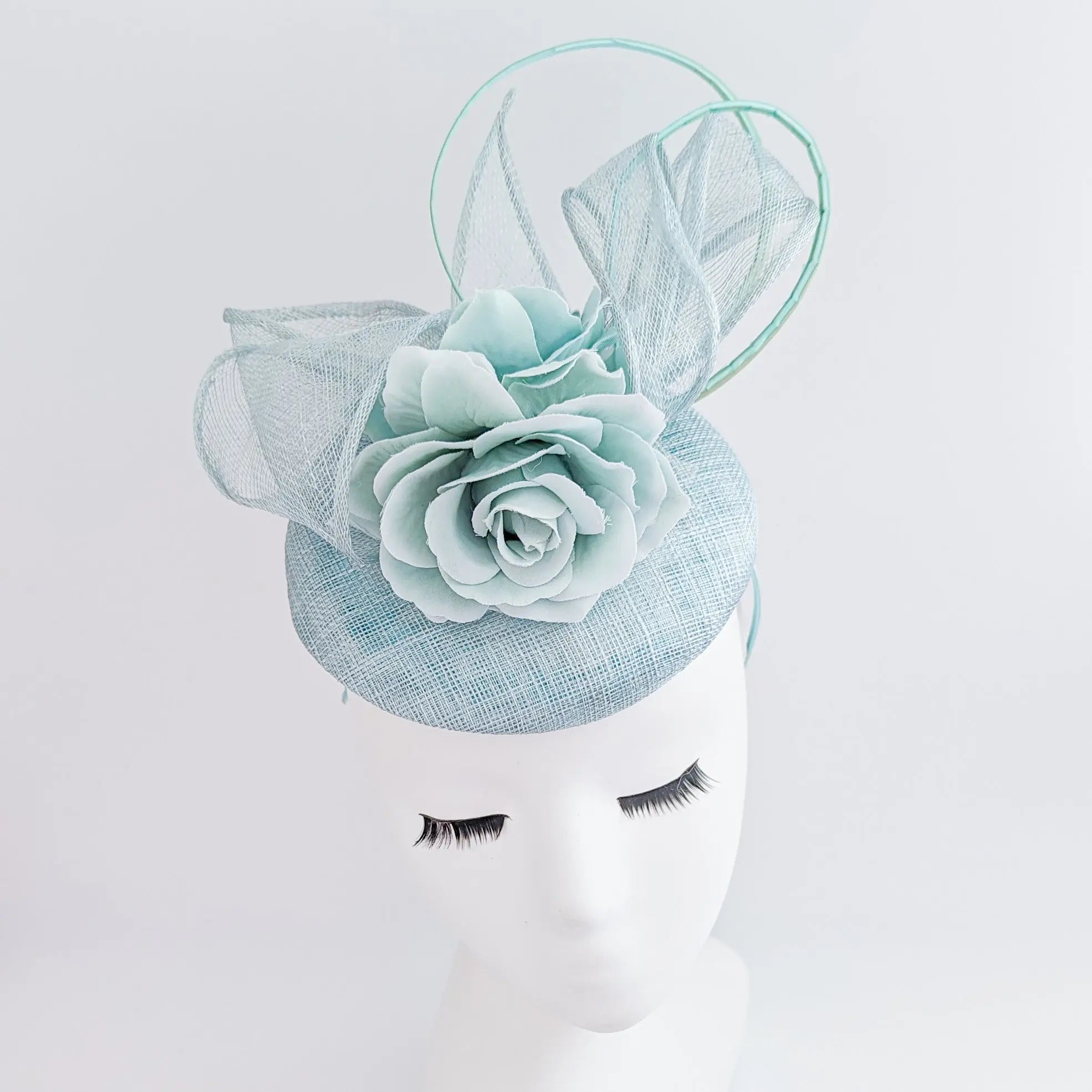 Aquamarine blue flower fascinator hat - House of Hats