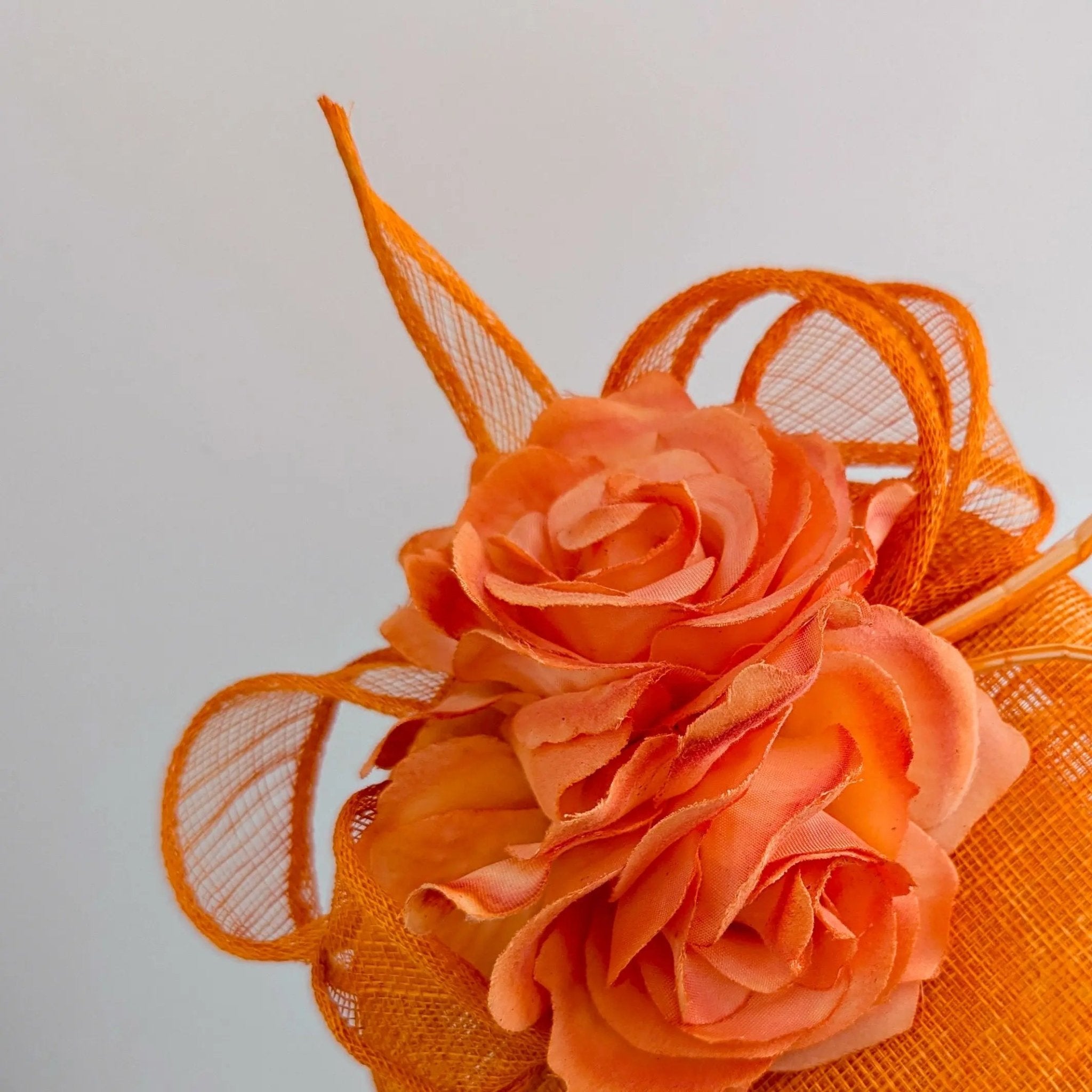 Bright orange coral flower fascinator hat - House of Hats