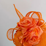 Bright orange coral flower fascinator hat - House of Hats