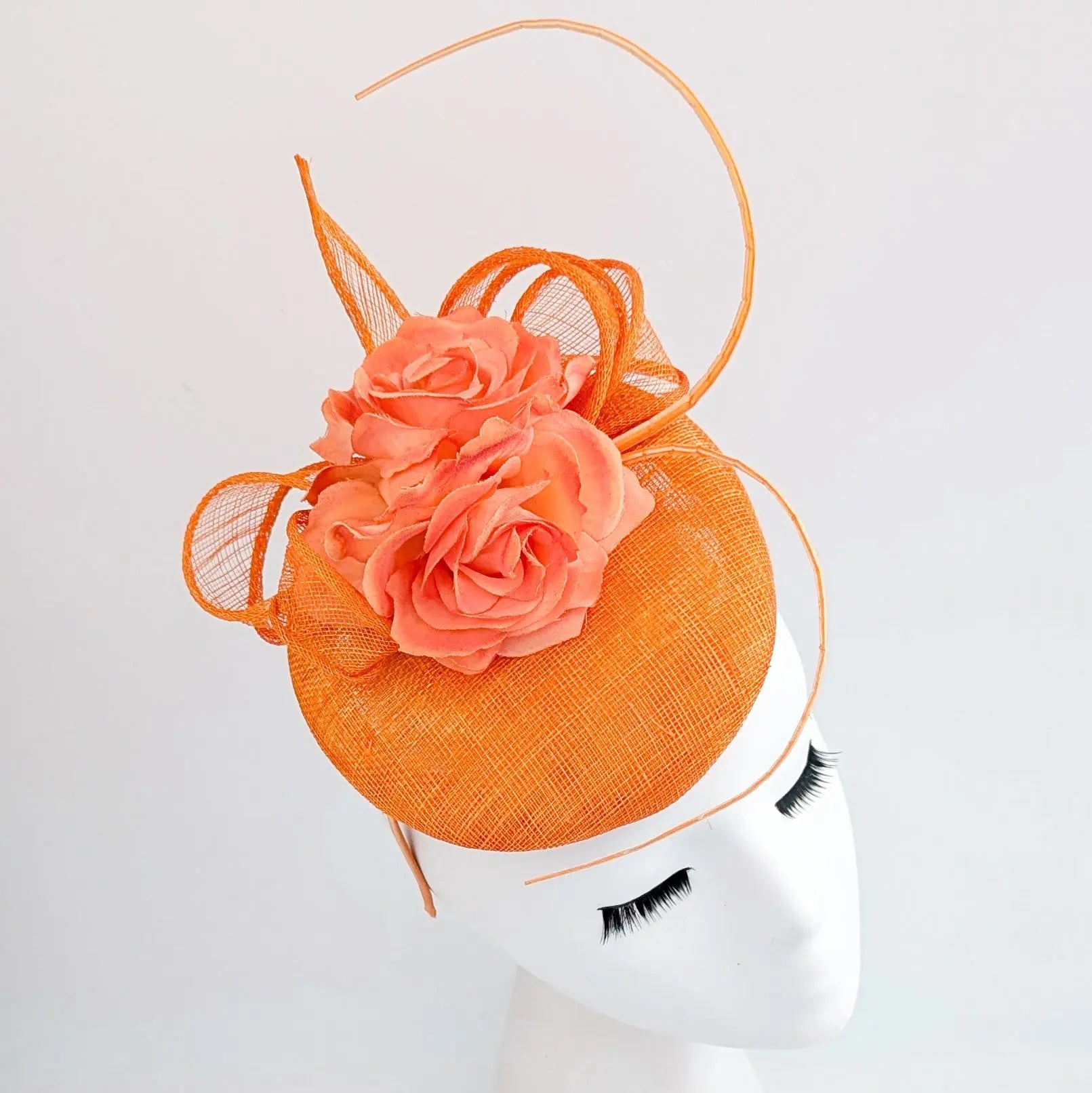 Bright orange coral flower fascinator hat - House of Hats