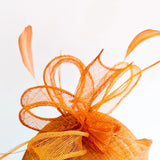 Burnt tangerine orange fascinator hat - House of Hats