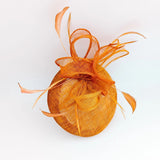 Burnt tangerine orange fascinator hat - House of Hats