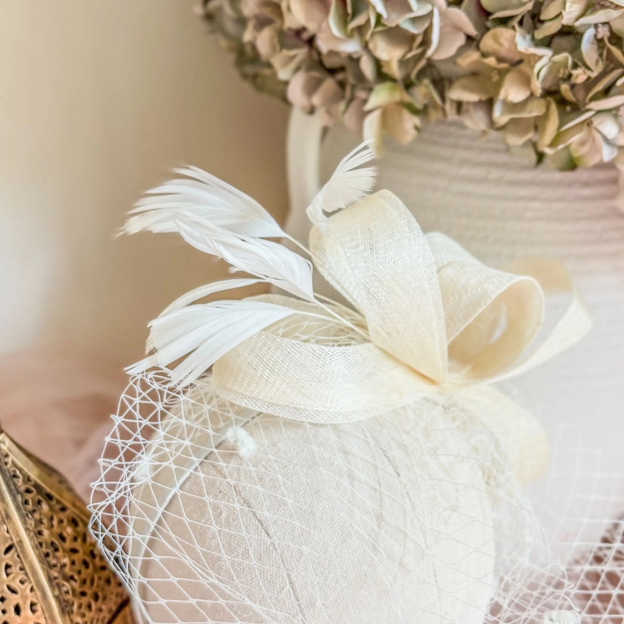 Cream feather fascinator hat - House of Hats