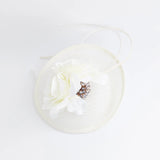 Cream flower disc saucer fascinator hat - House of Hats