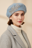 Model wearing a powder blue crystal wool felt French beret hat