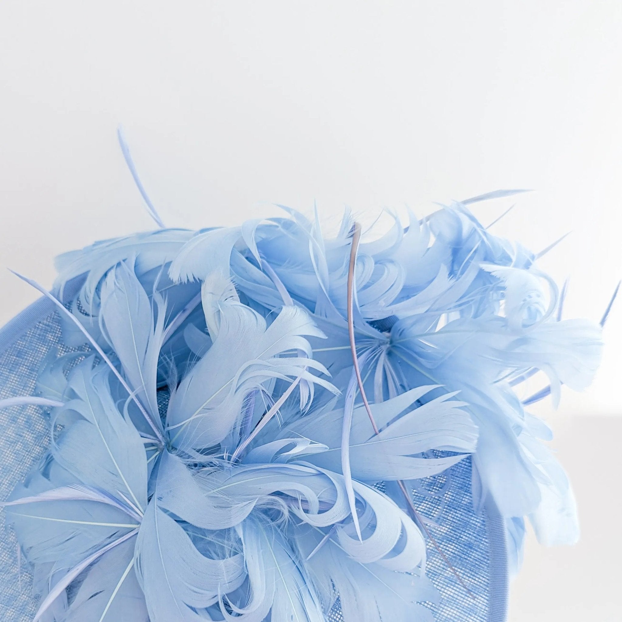Light cornflower blue large feather saucer disc fascinator hat - House of Hats