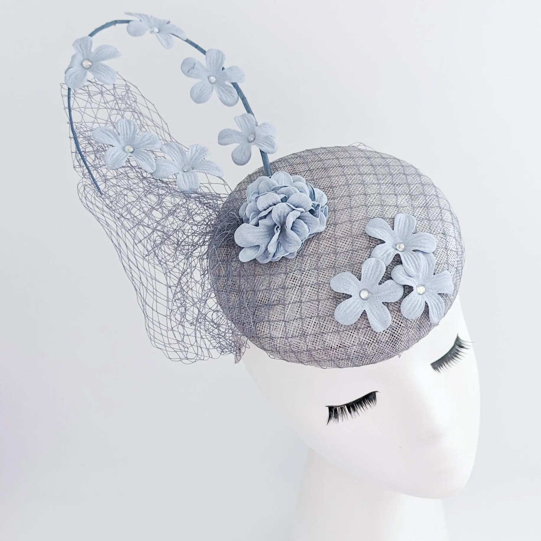 Light dusty blue flower fascinator hat - House of Hats