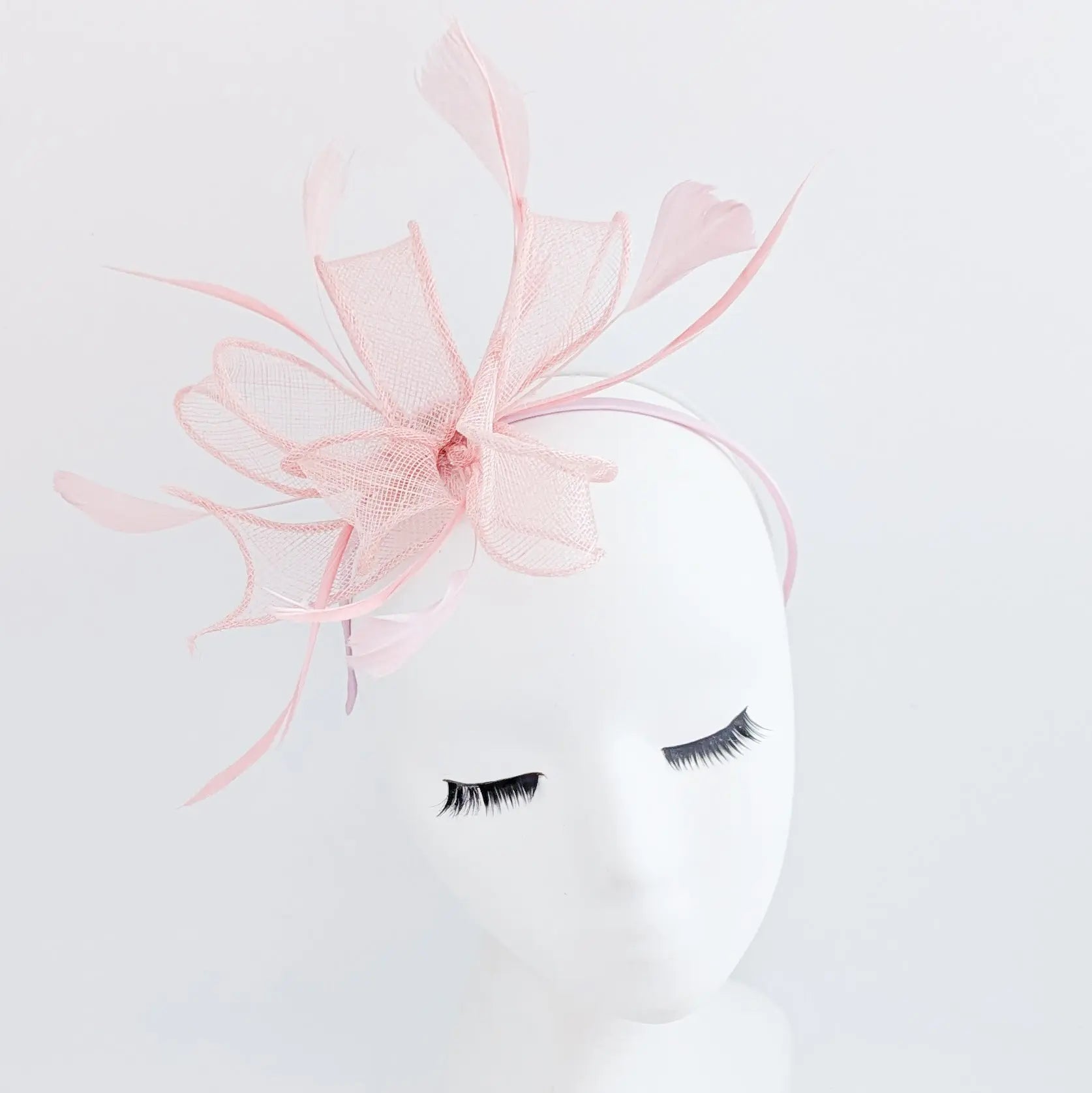 Light pink feather fascinator hat - House of Hats