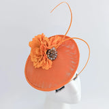 Orange flower disc saucer fascinator hat - House of Hats