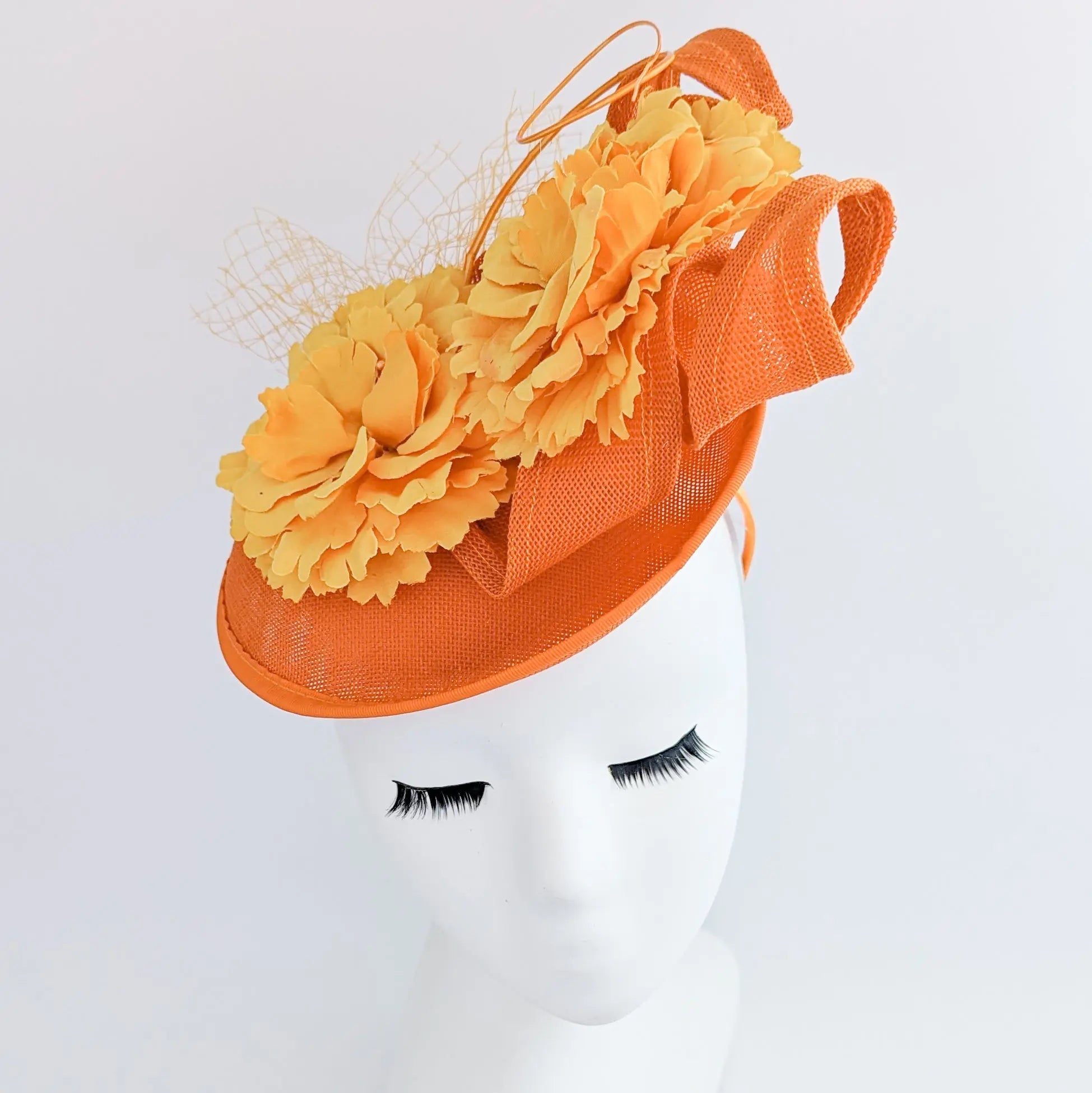 Orange flower fascinator disc saucer hat - House of Hats