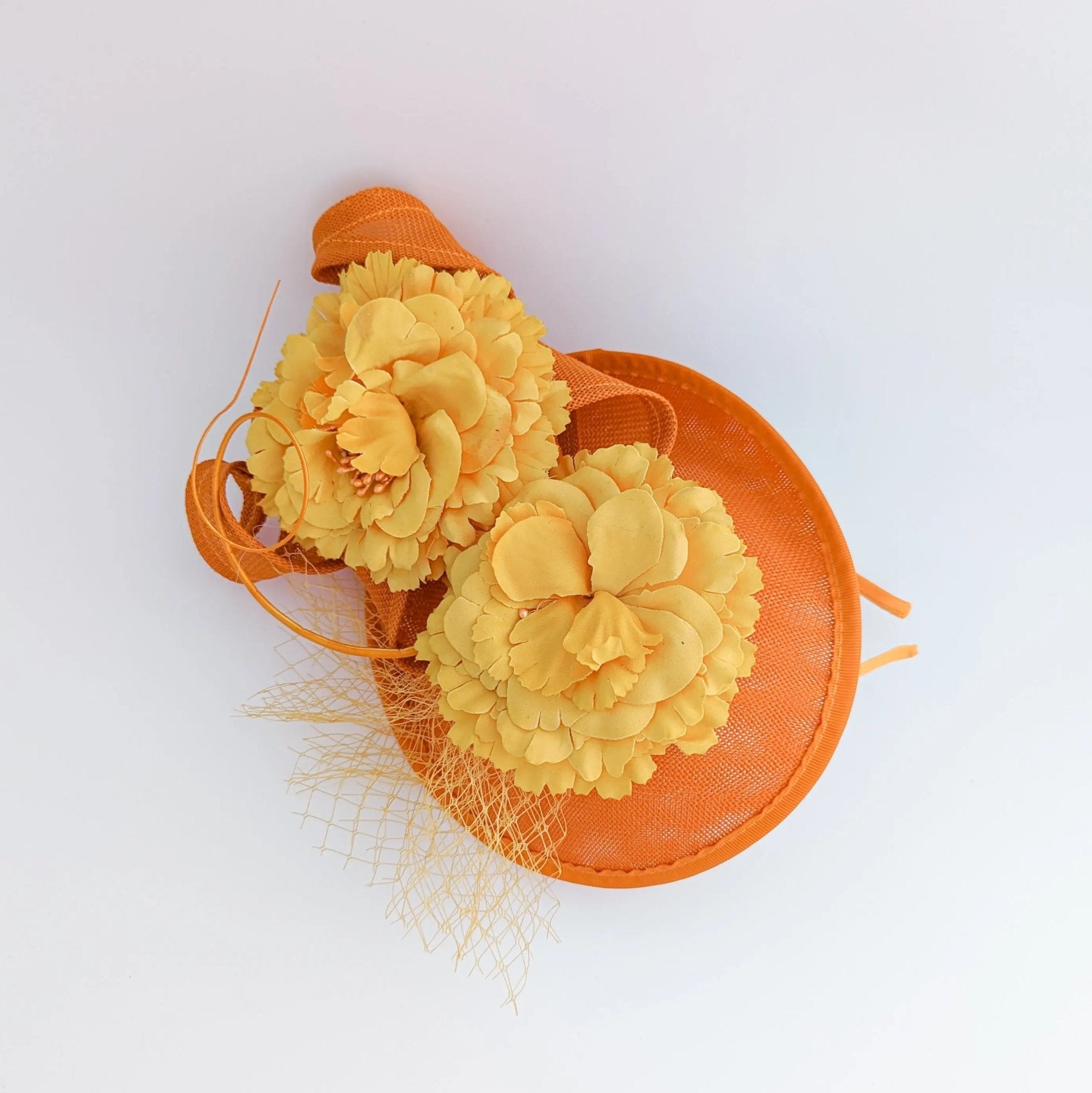 Orange flower fascinator disc saucer hat - House of Hats