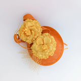 Orange flower fascinator disc saucer hat - House of Hats