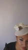 Cream flower disc saucer fascinator hat