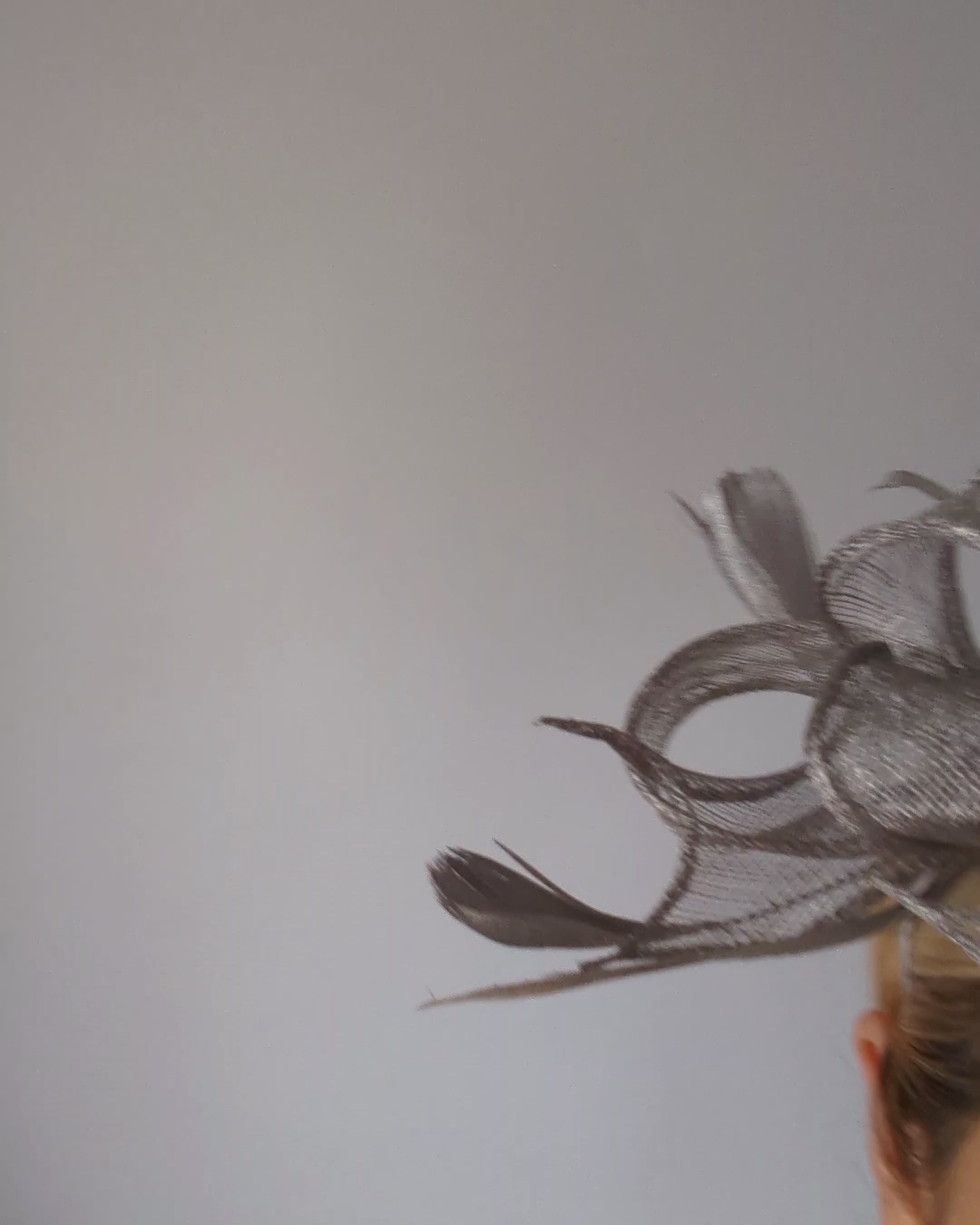 Silver shimmer feather fascinator hat