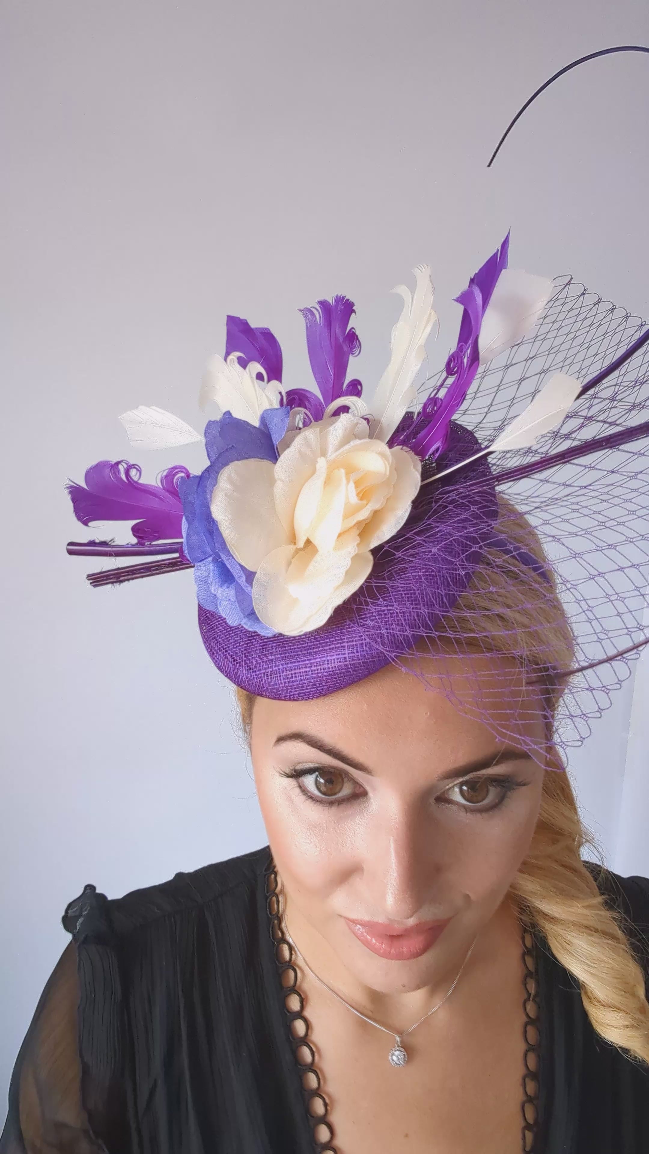 Cadbury purple flower feather fascinator hat