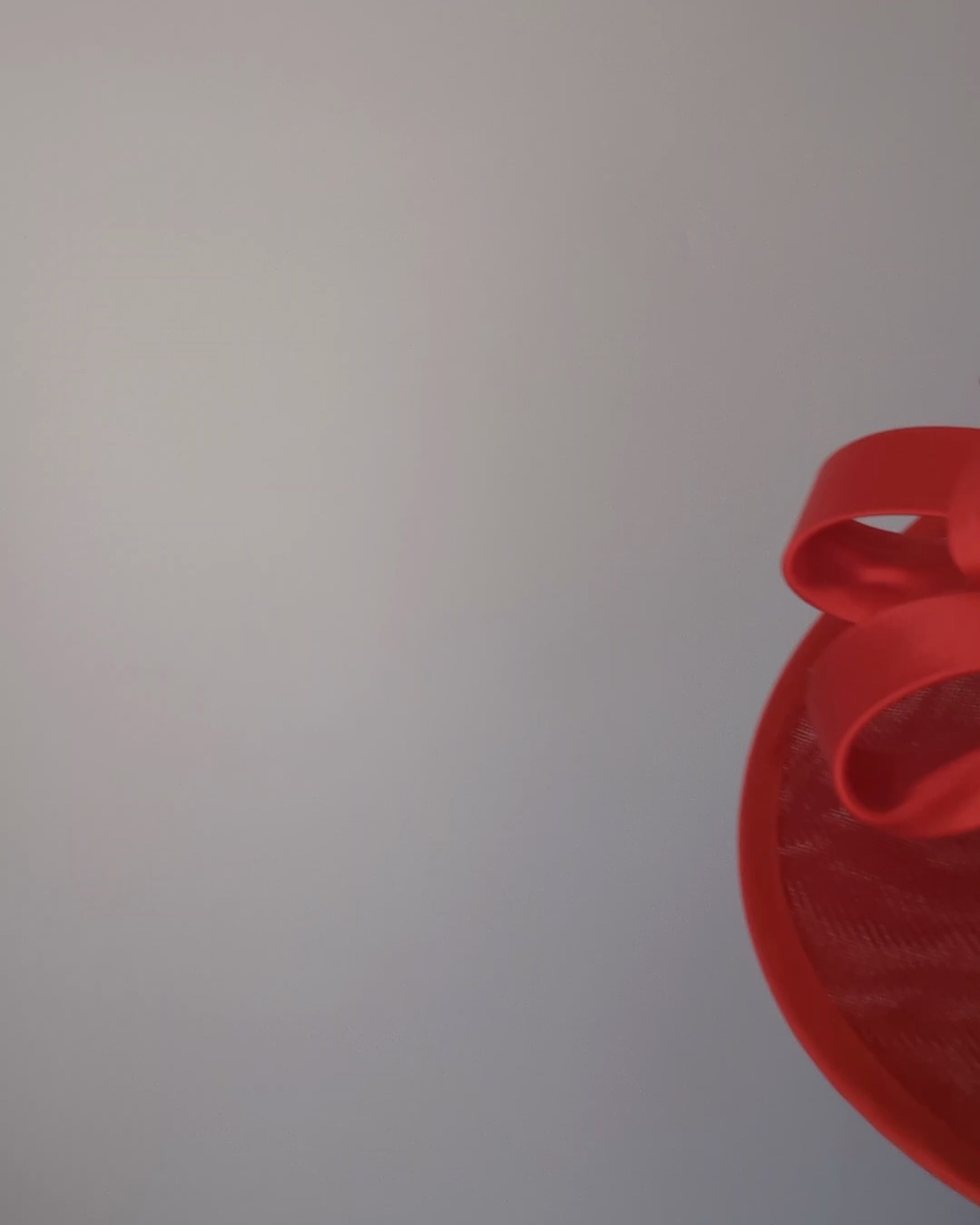 Red feather large saucer disc fascinator hat