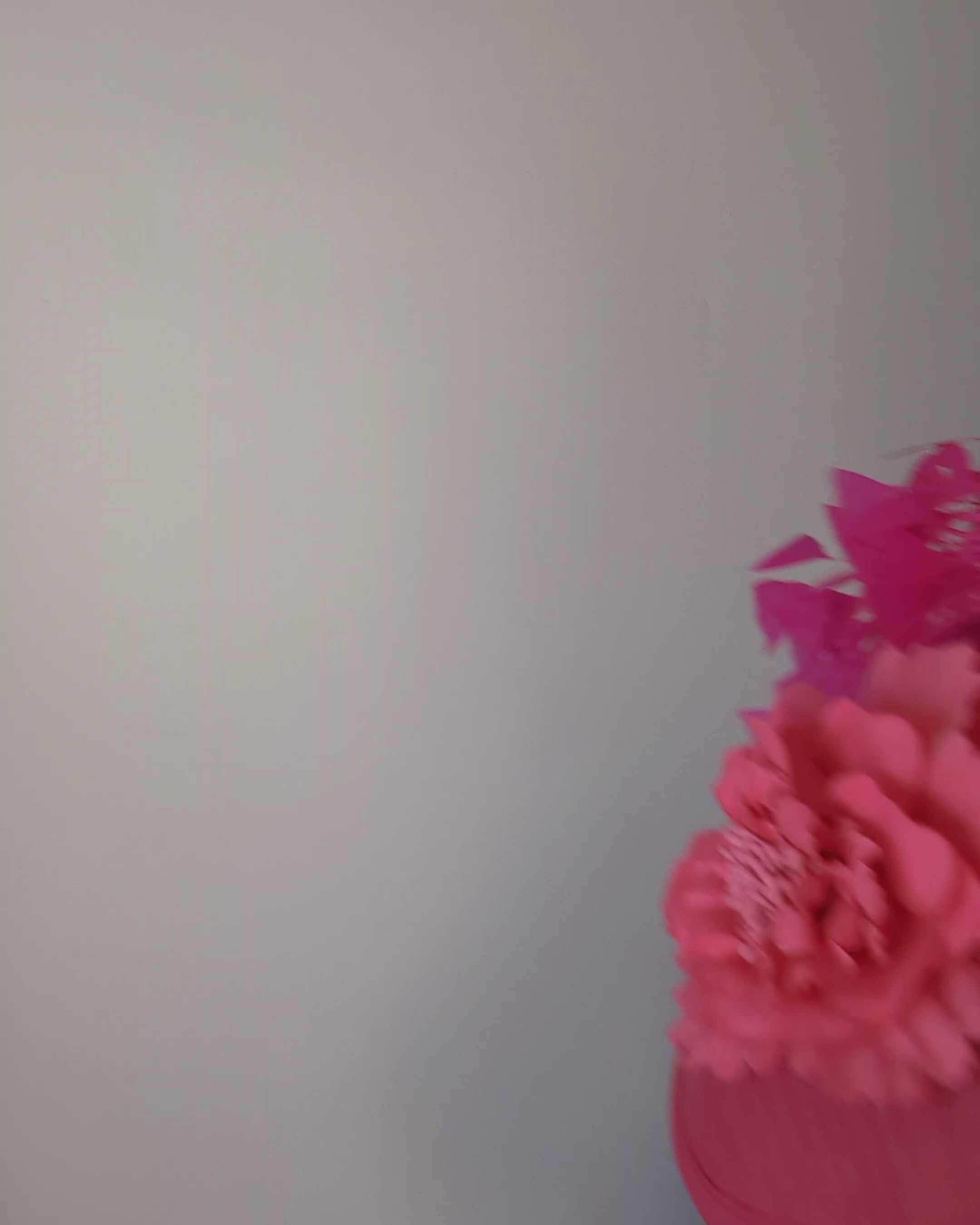 Fuchsia pink flower feather disc saucer fascinator hat