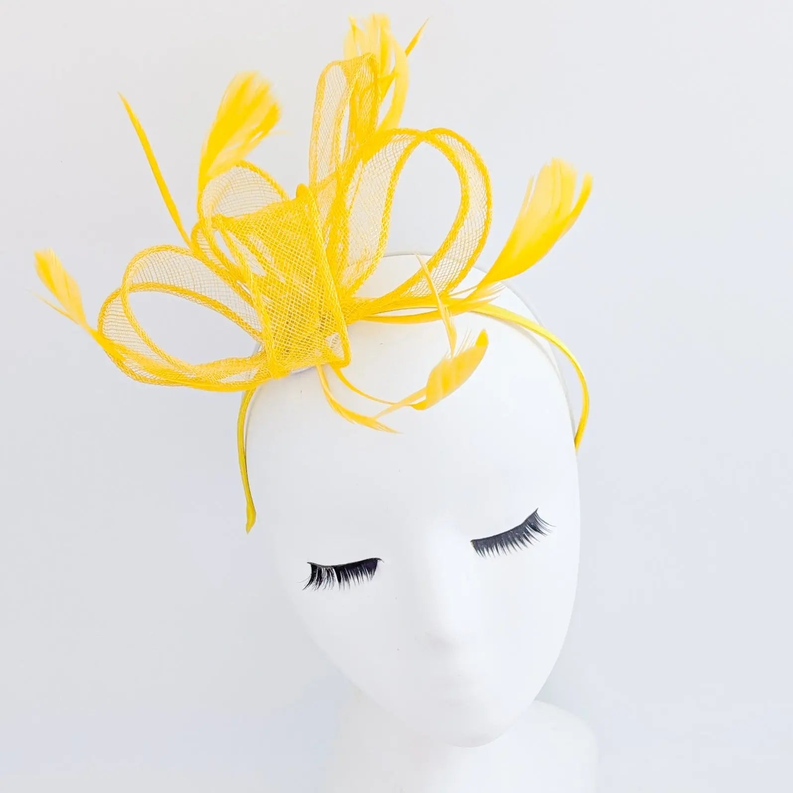 Yellow feather fascinator hat - House of Hats